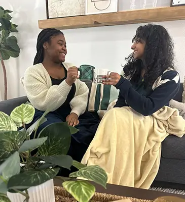 two young women enjoying coffee