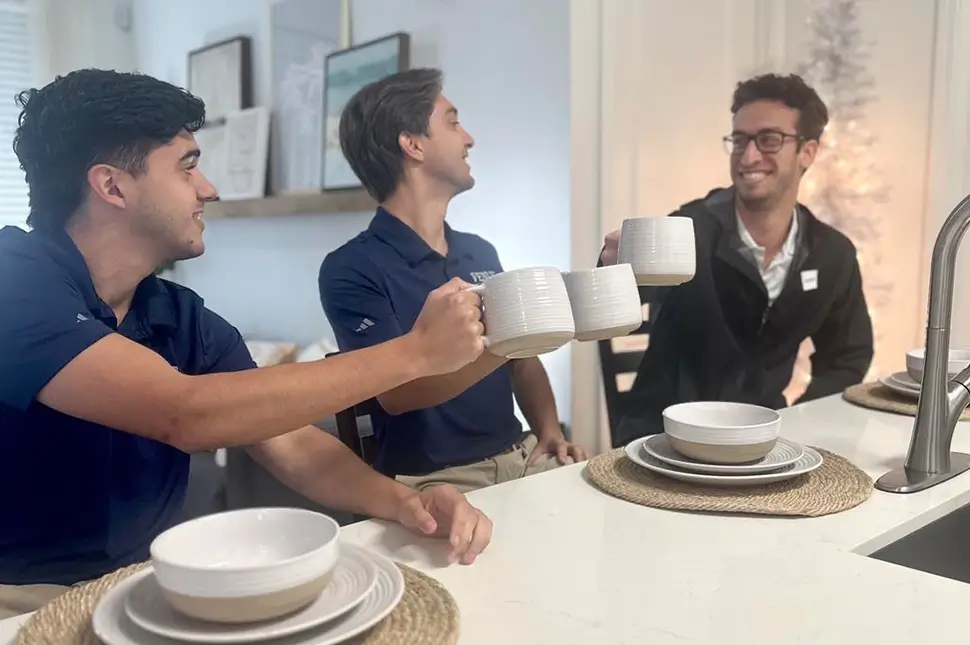 3 young men enjoying coffee